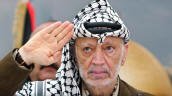 
Palestinian leader Yasser Arafat salutes while attending the Palestinian Islamic Christians Conference at his compound in the West Bank town of Ramallah, Aug. 10, 2004.  (AP Photo/Muhammed Muheisen)