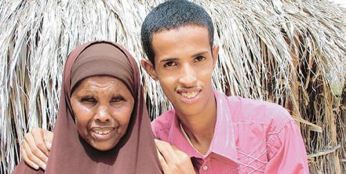 Abdi Ahmed Mohammed, the top boy in the 2008 KCPE exams in North Eastern Province with 434 points out of a possible 500. He is with his grandmother Khadija Omar Hassan, who encouraged his parents to take him to school. Photo/BASKASH JUGSODA’AY